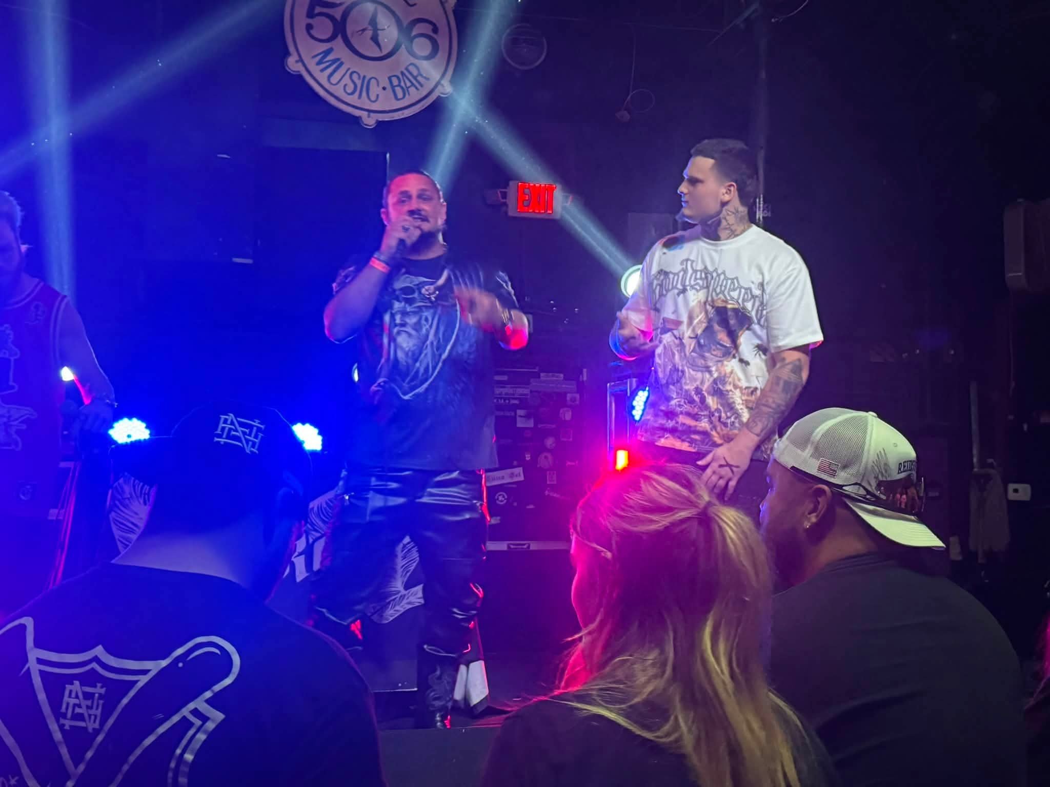 Kaspa Killa performing under blue stage lights at 506 Music Bar