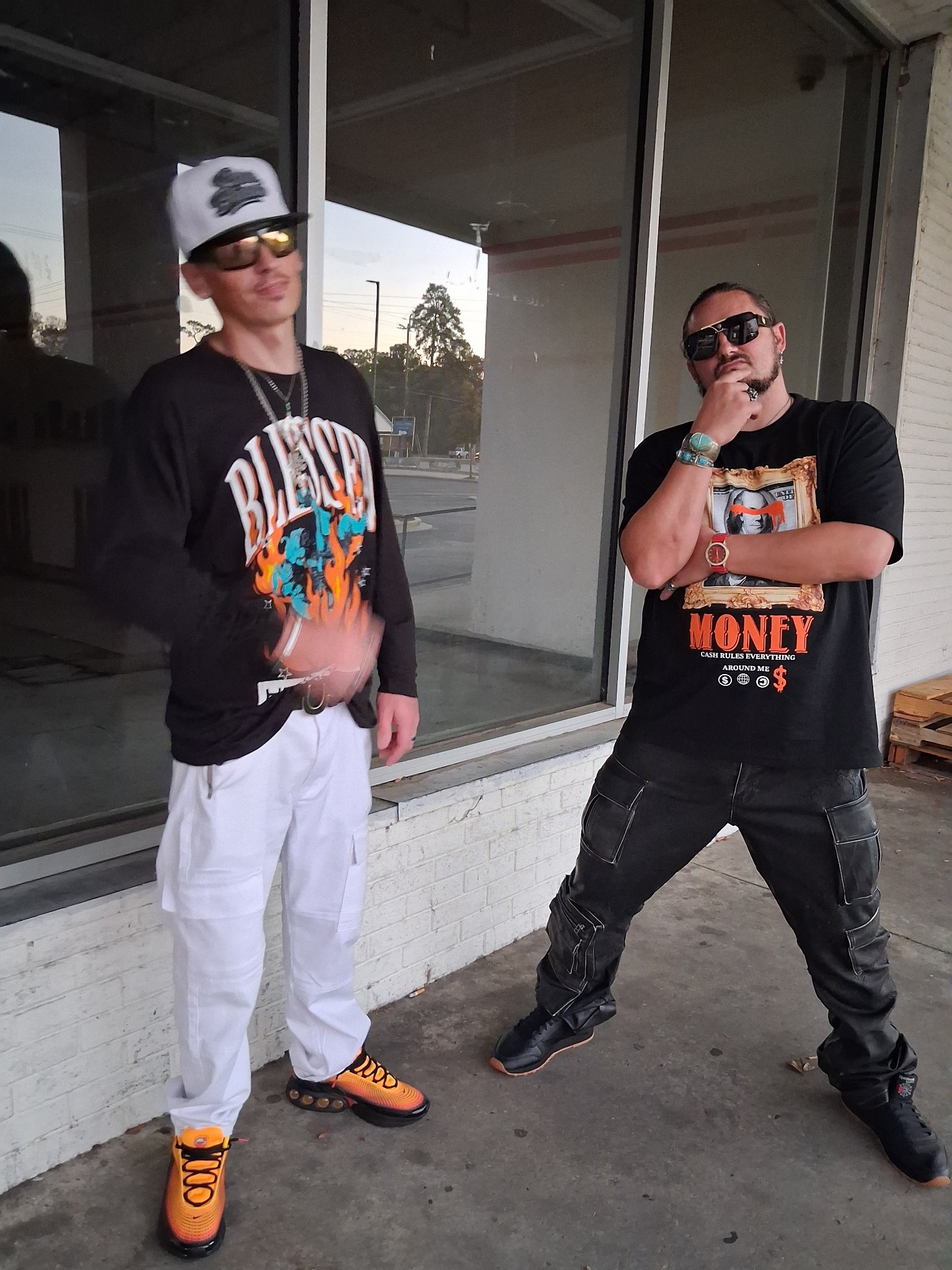 Kaspa Killa with $toney outside a store