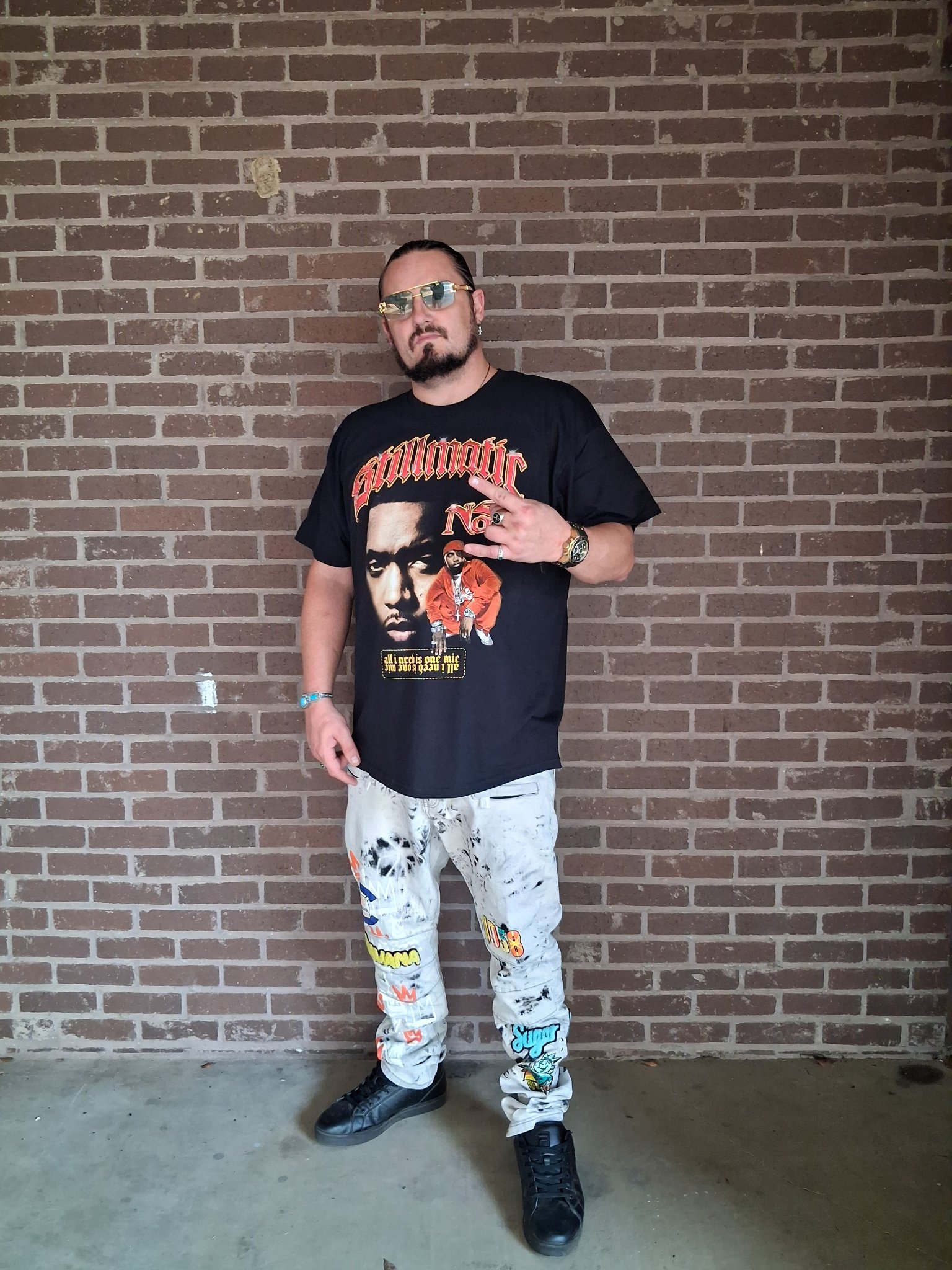 Kaspa Killa against a brick wall