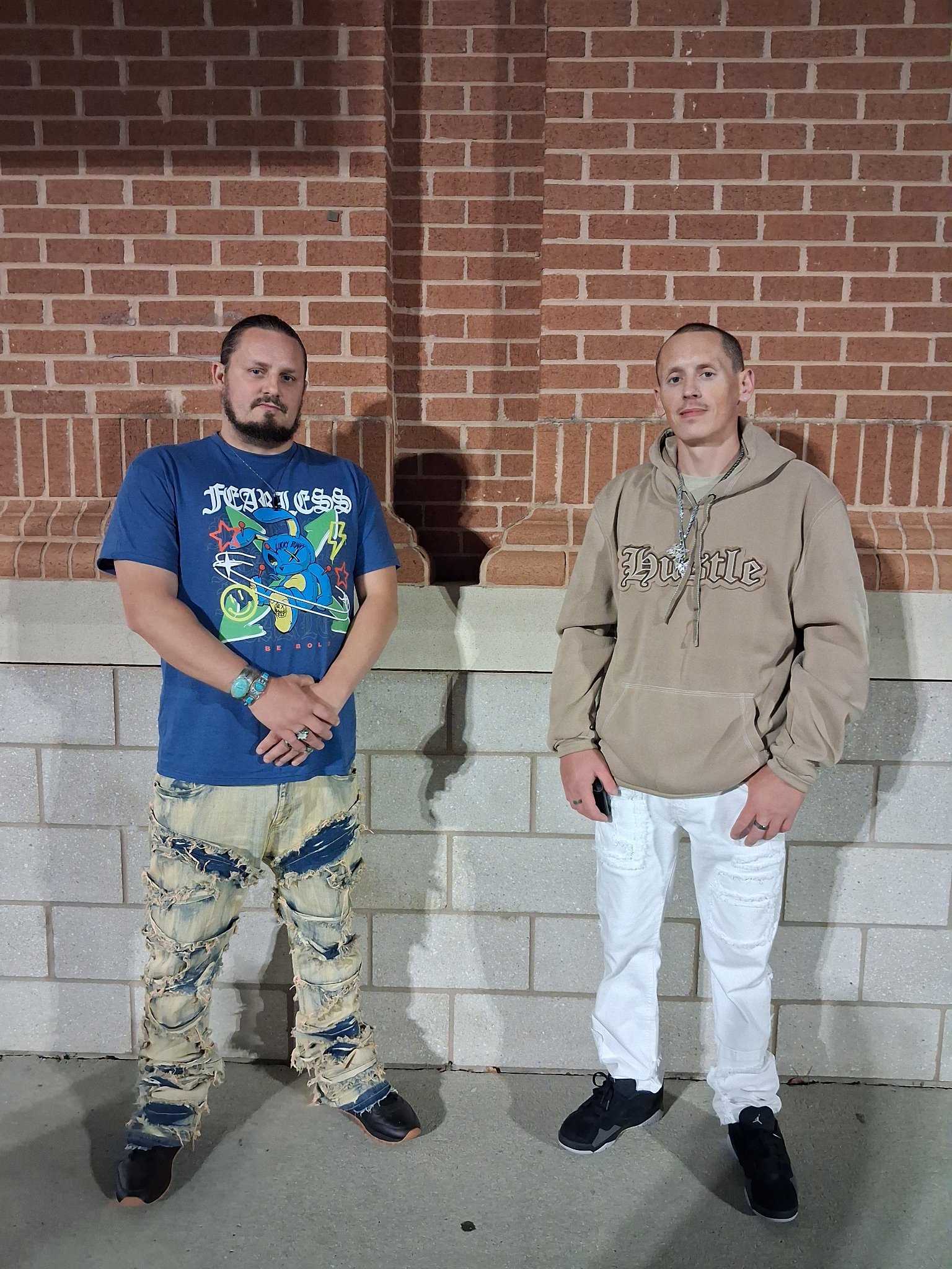 Kaspa Killa with $toney against a brick wall