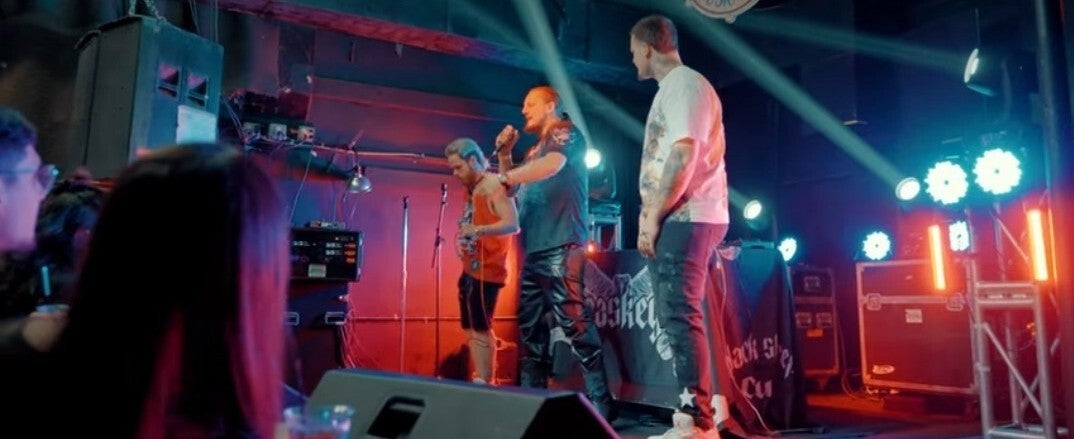 Kaspa Killa performing on stage with other artists