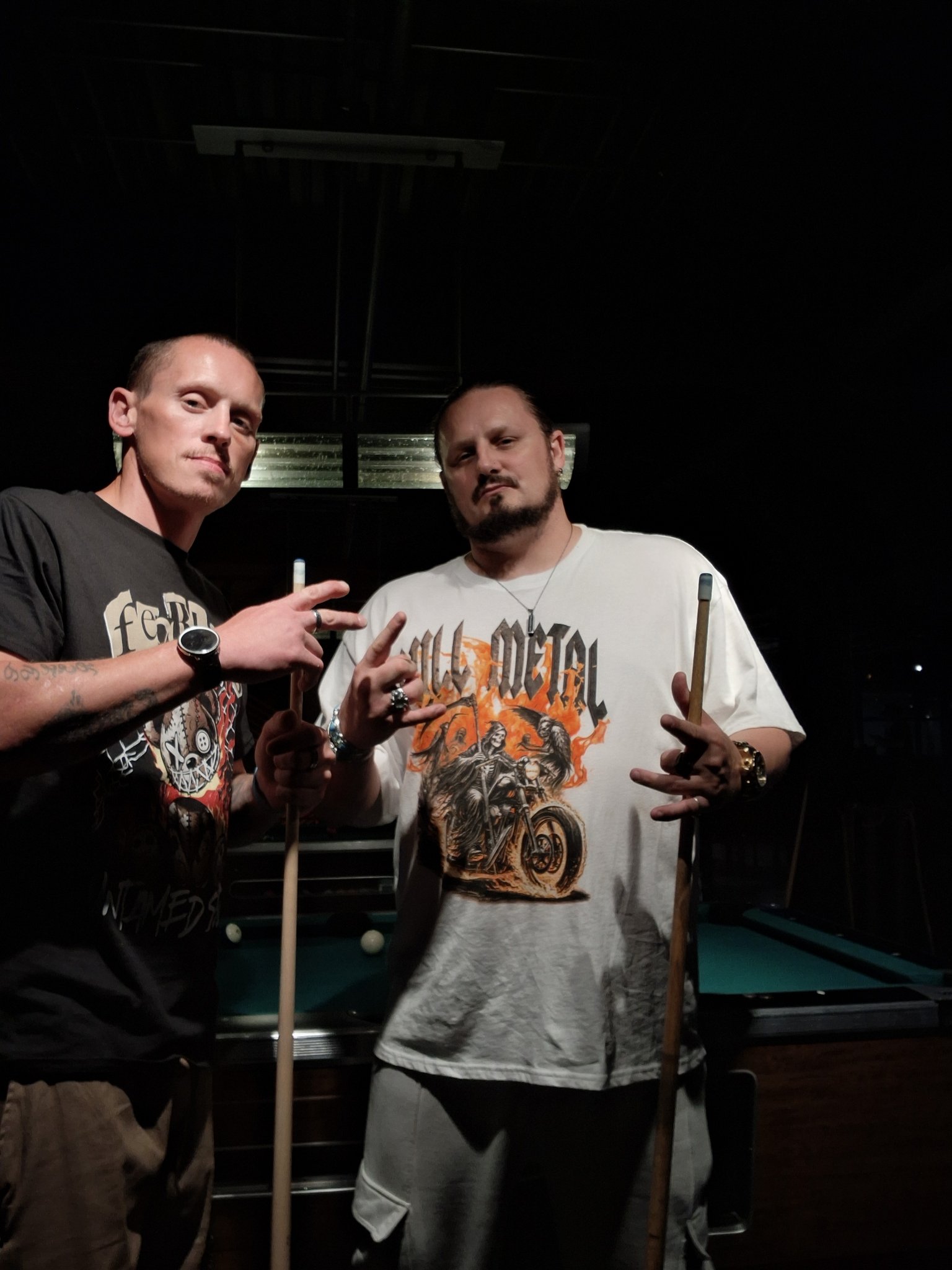 Kaspa Killa and $toney holding pool cues at a pool hall