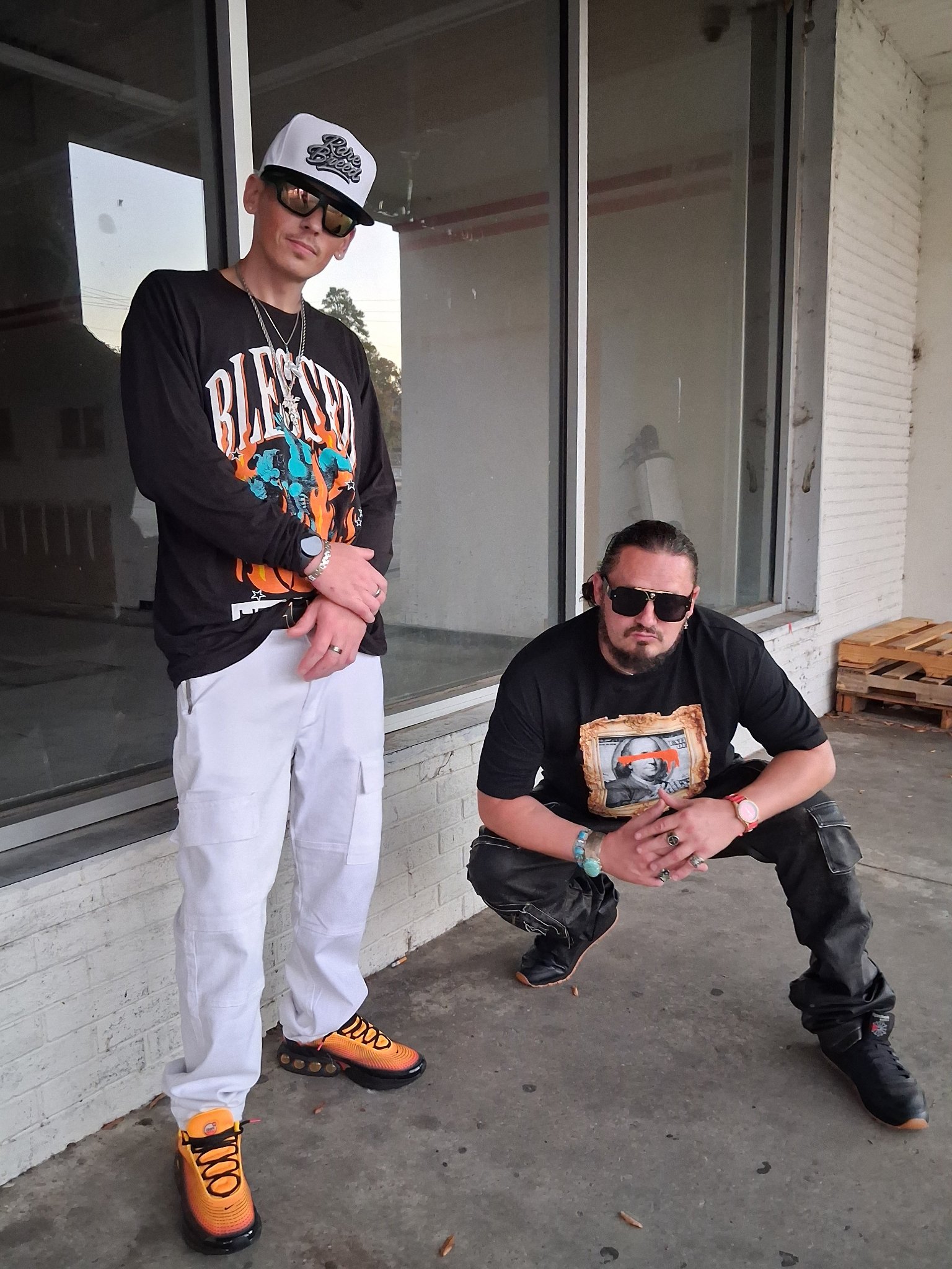 Kaspa Killa with $toney outside a store